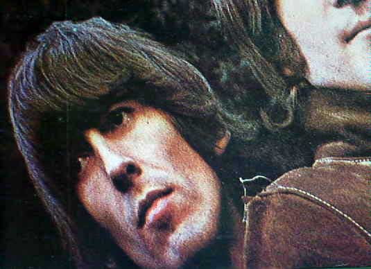 Closeup of Rubber Soul cover showing loose thread on the shoulder of Johns jacket