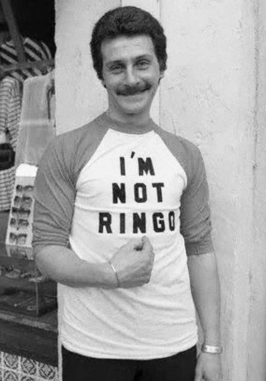 Pete Best wearing a shirt that says "I'm Not Ringo," 1982
